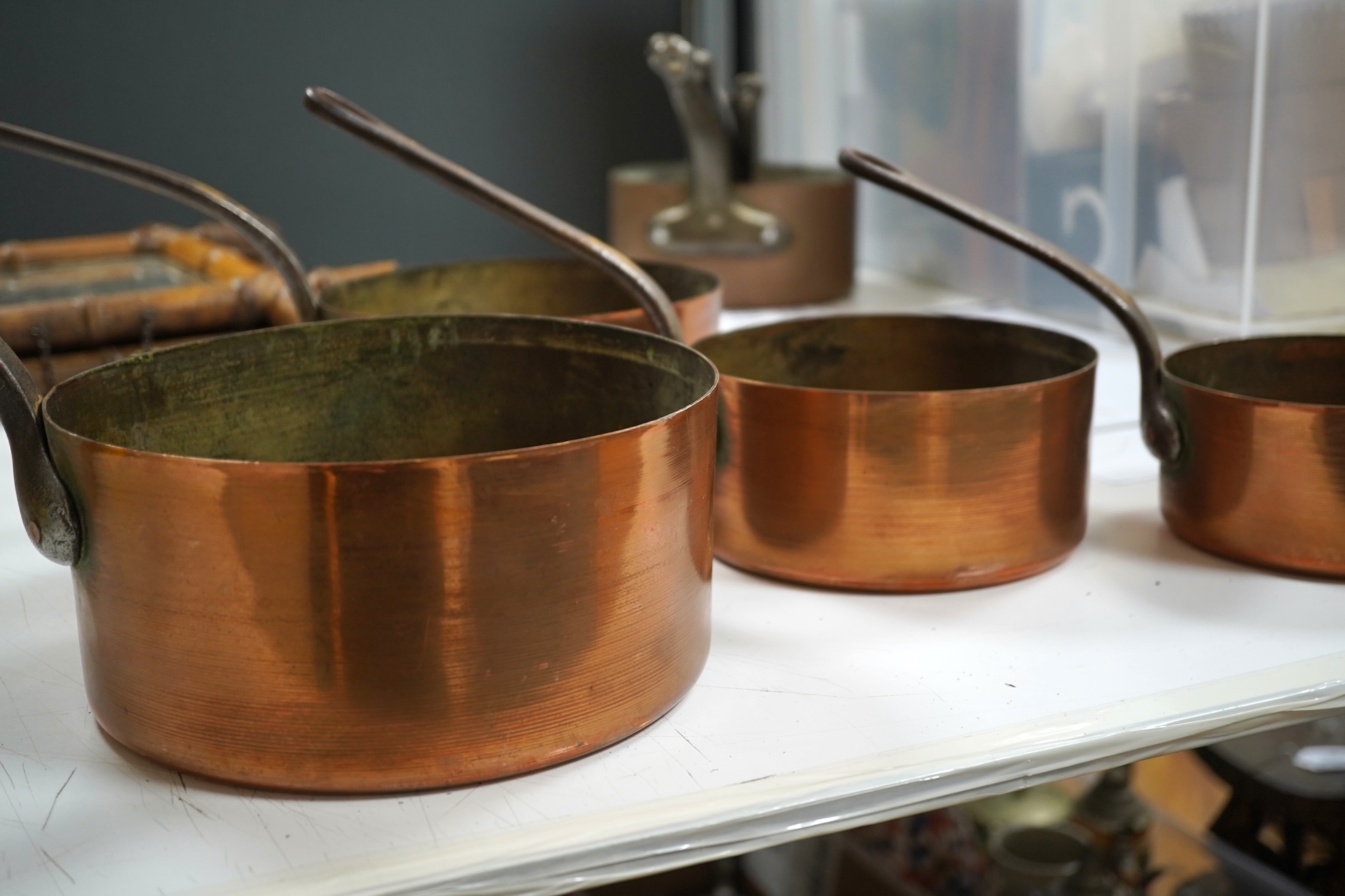 A graduated set of seven French copper pans